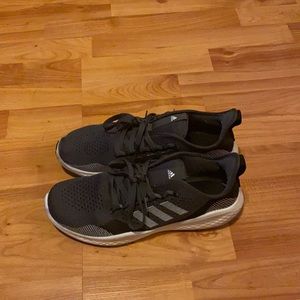 Black and white Adidias men’s tennis shoes